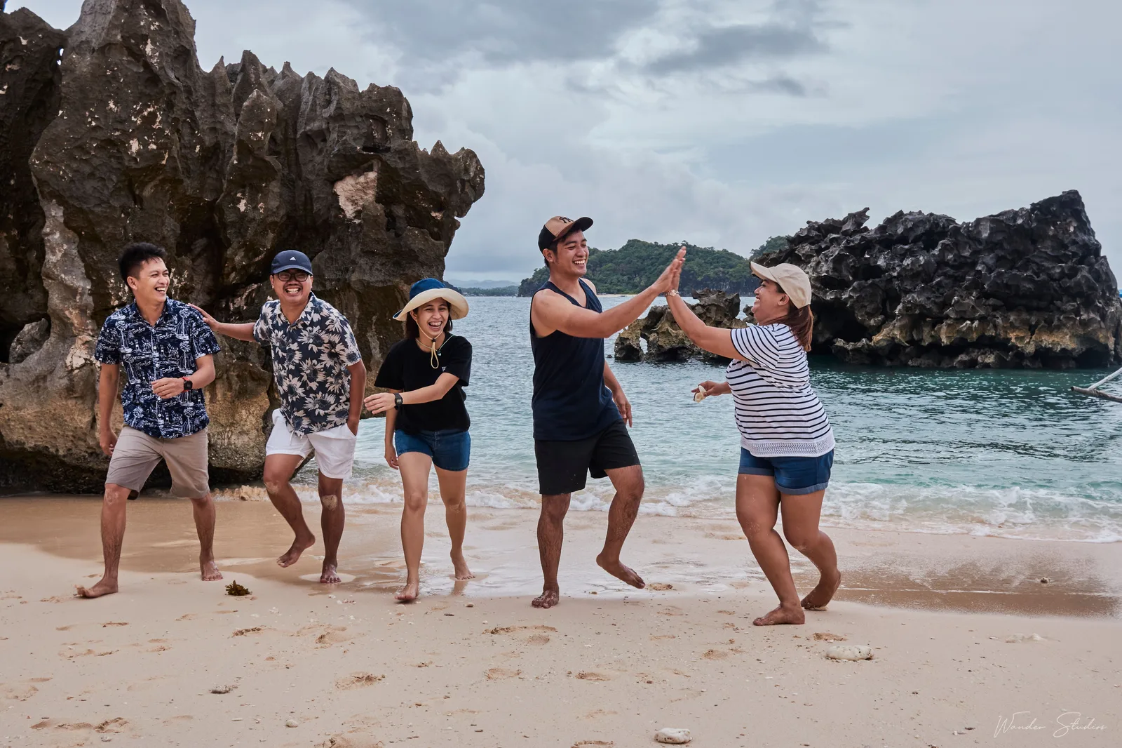 Photo: Marjhan Ramboyong / Pexels License, via Pexels A group of friends laughing together on a Philippine beach